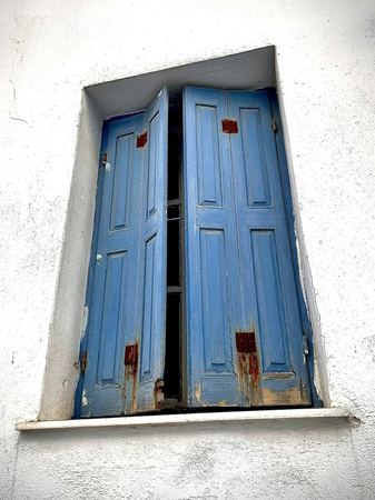 Blue Shutters, Cycladic Wall — photograph by Randy Polito