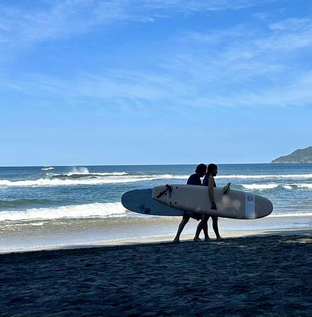 Surfers, Morning Beach — photograph by Randy Polito