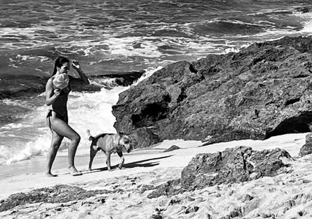 Woman and Dog, Rocky Shore — photograph by Randall Polito