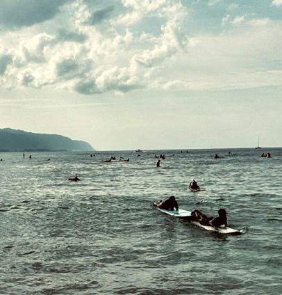 Surfers, Paddling Out — photograph by Randy Polito