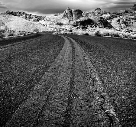 Desert Road, Cracked Pavement — photograph by Randy Polito