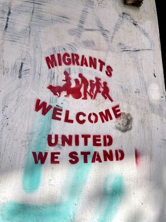 Migrants Welcome, Street Stencil — photograph by Randall Polito