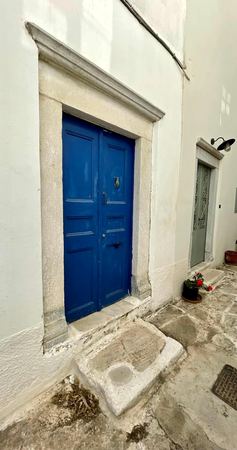 Blue Door, Whitewashed Alley — photograph by Randy Polito