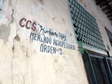 Mercado Agropecuario, Weathered Sign — photograph by Randy Polito